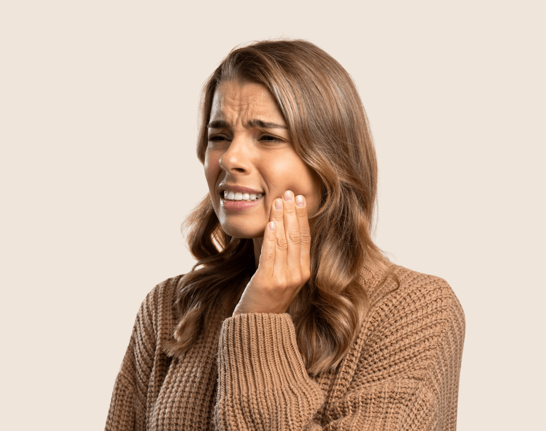 Woman holding her jaw in pain